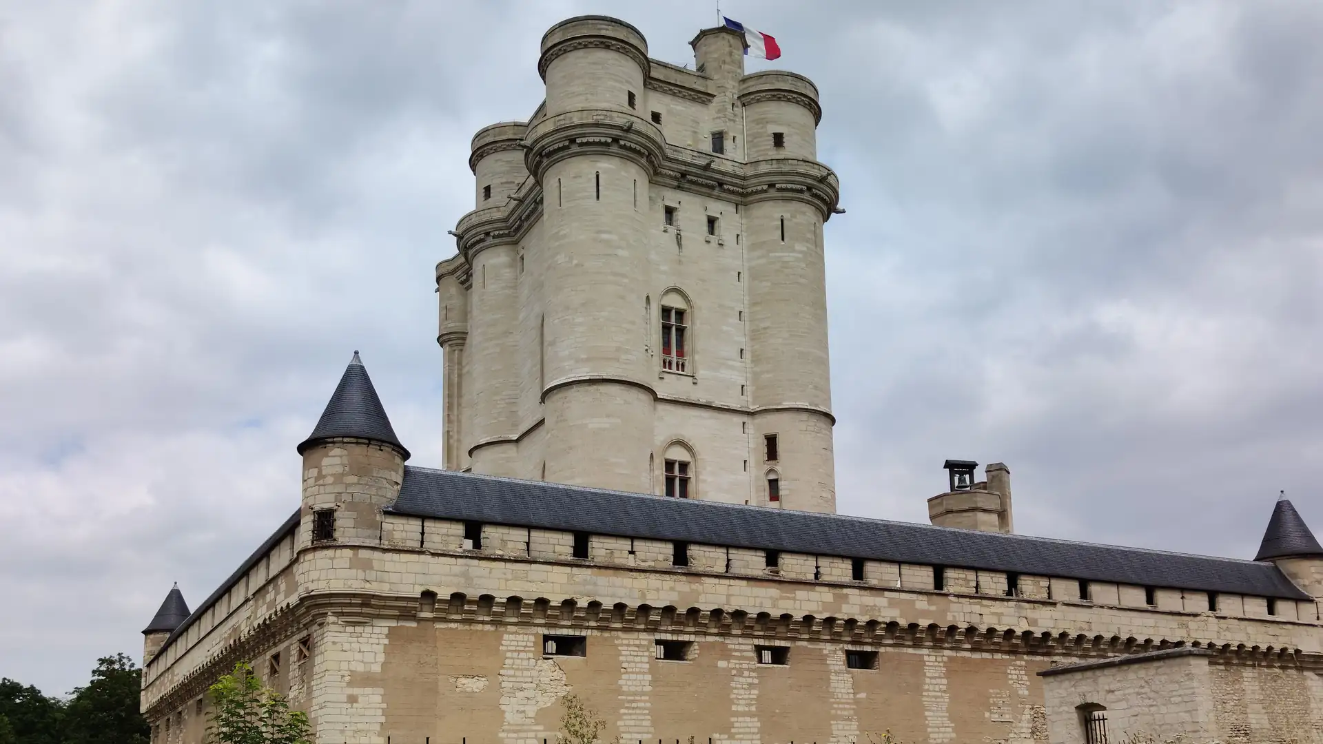 The great keep of the Château de Vincennes, its four corner turrets rising above the slate-roofed curtain wall